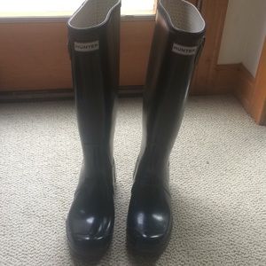 Tall black hunter boots